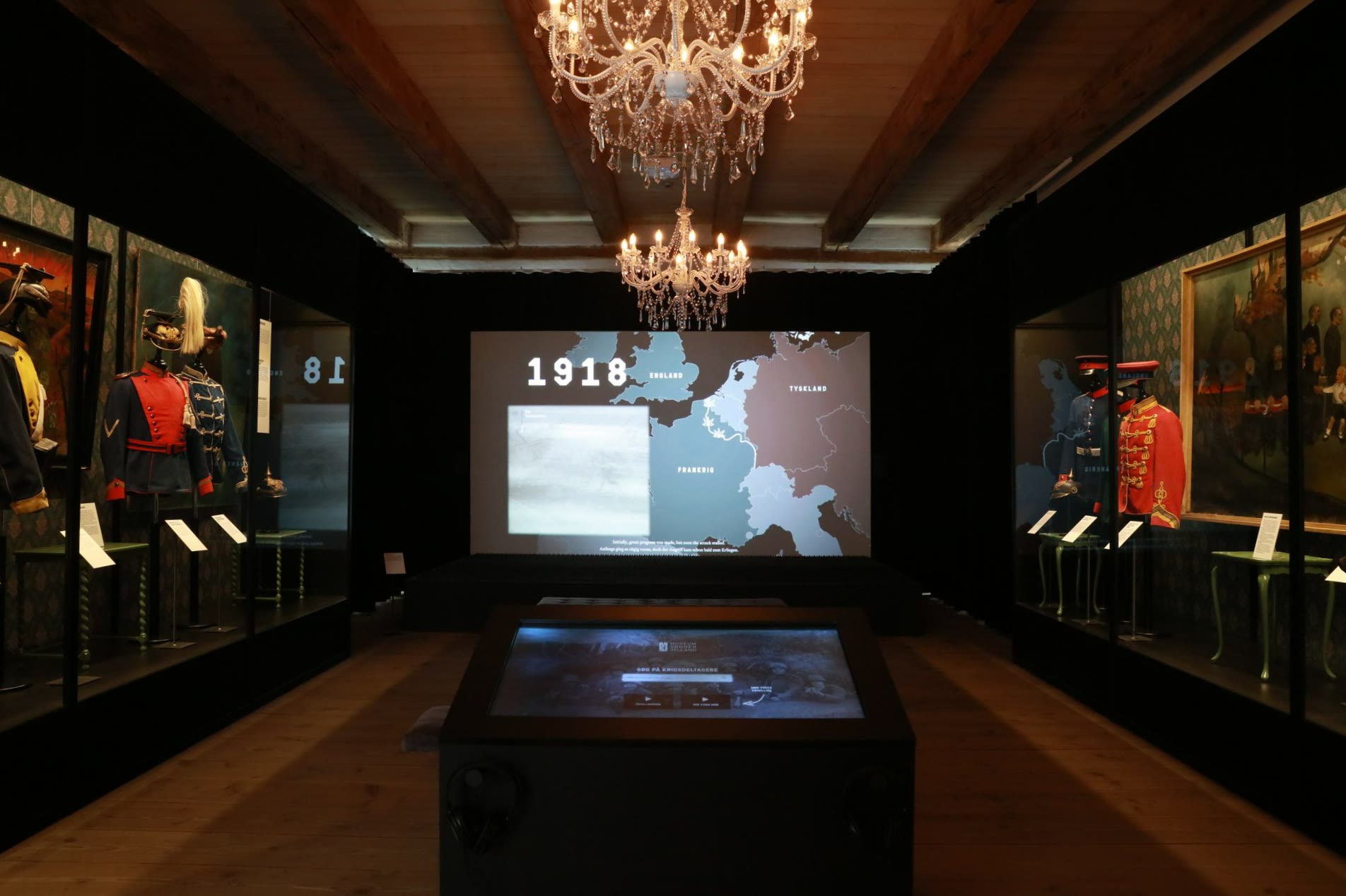 The room with the chandeliers and the projected map