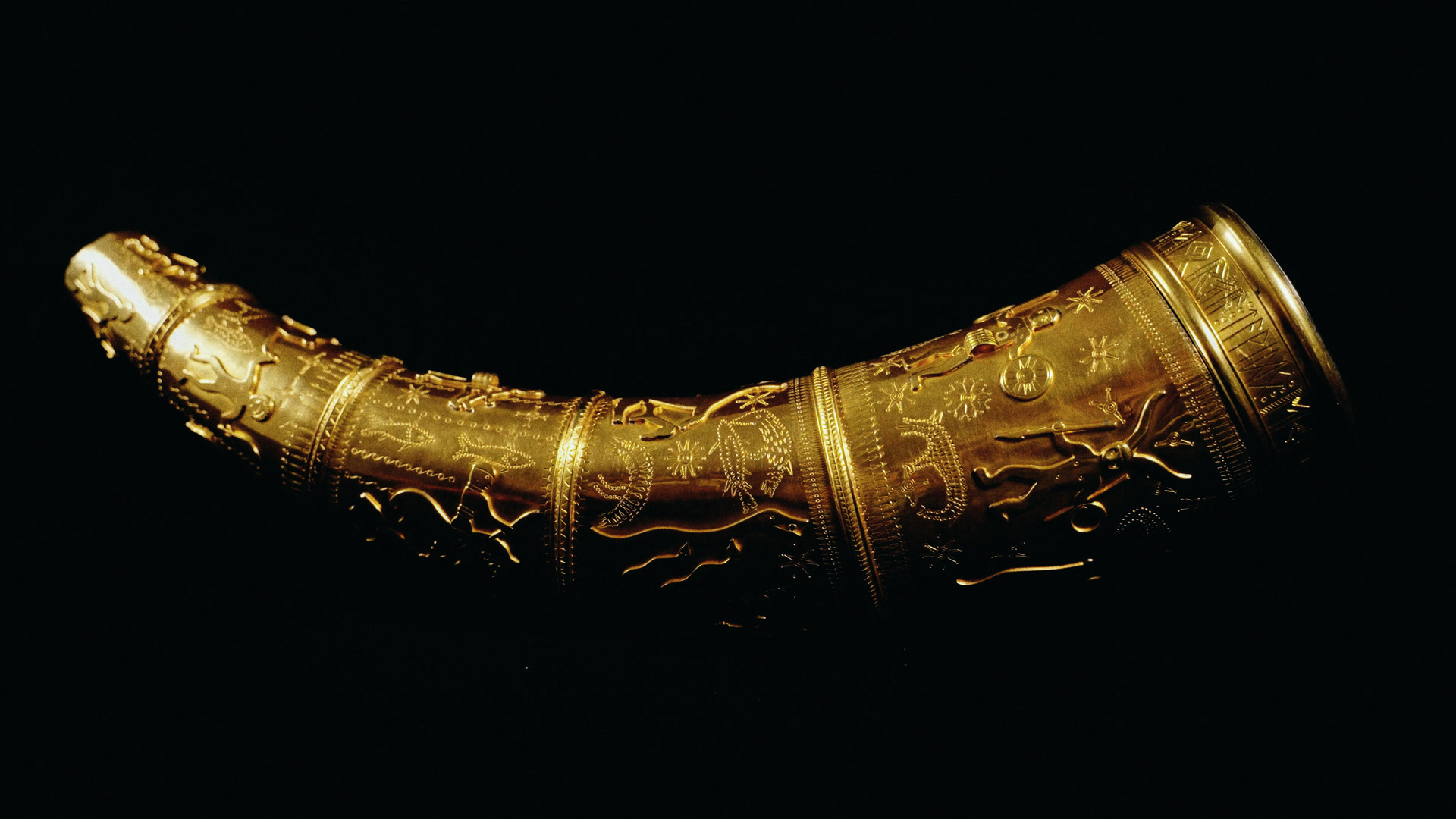 The short golden horn on black