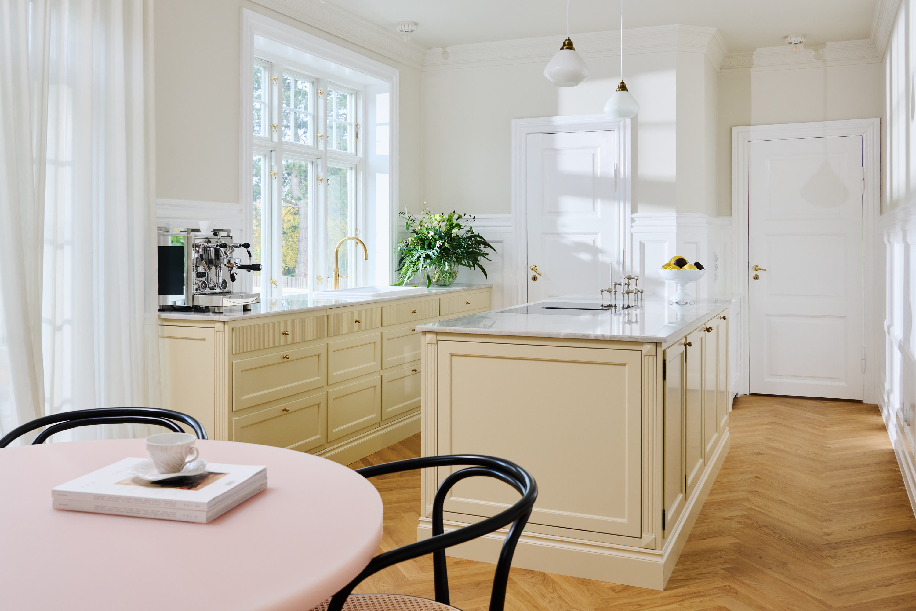 The kitchen and the dining table, seen from the dining room