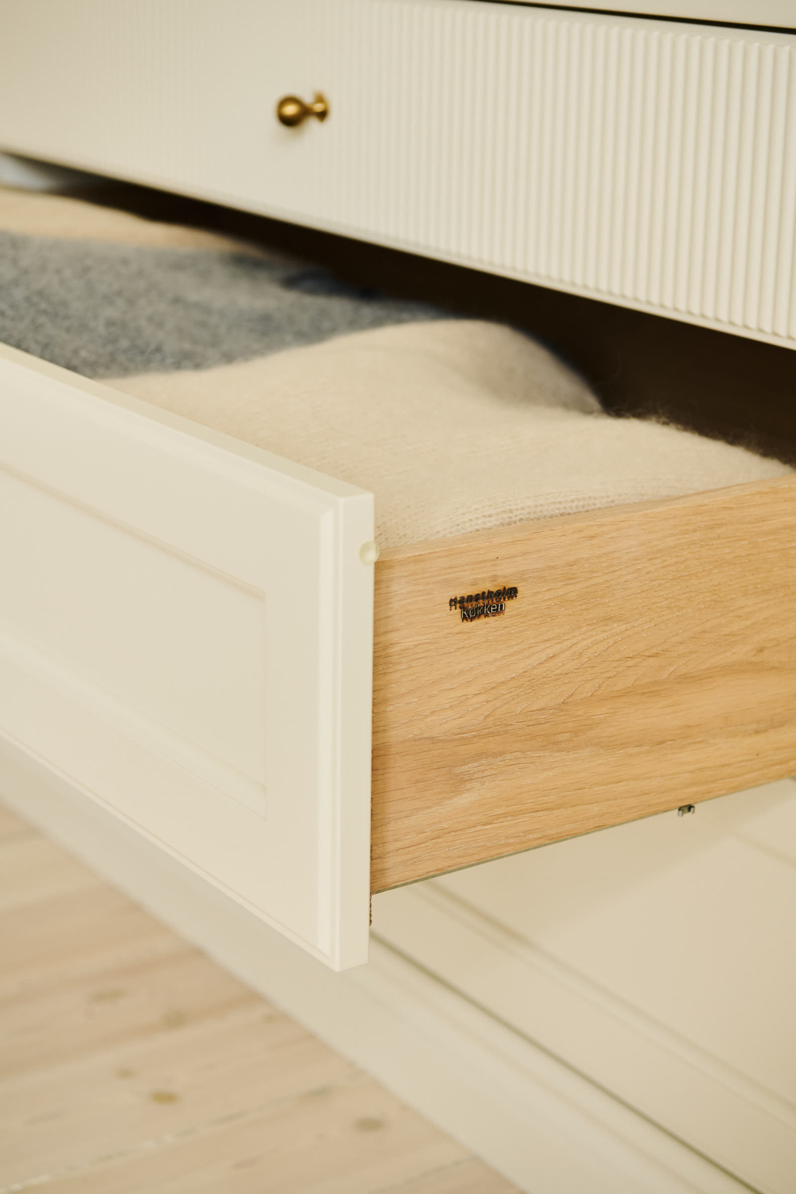 An open drawer with folded linen