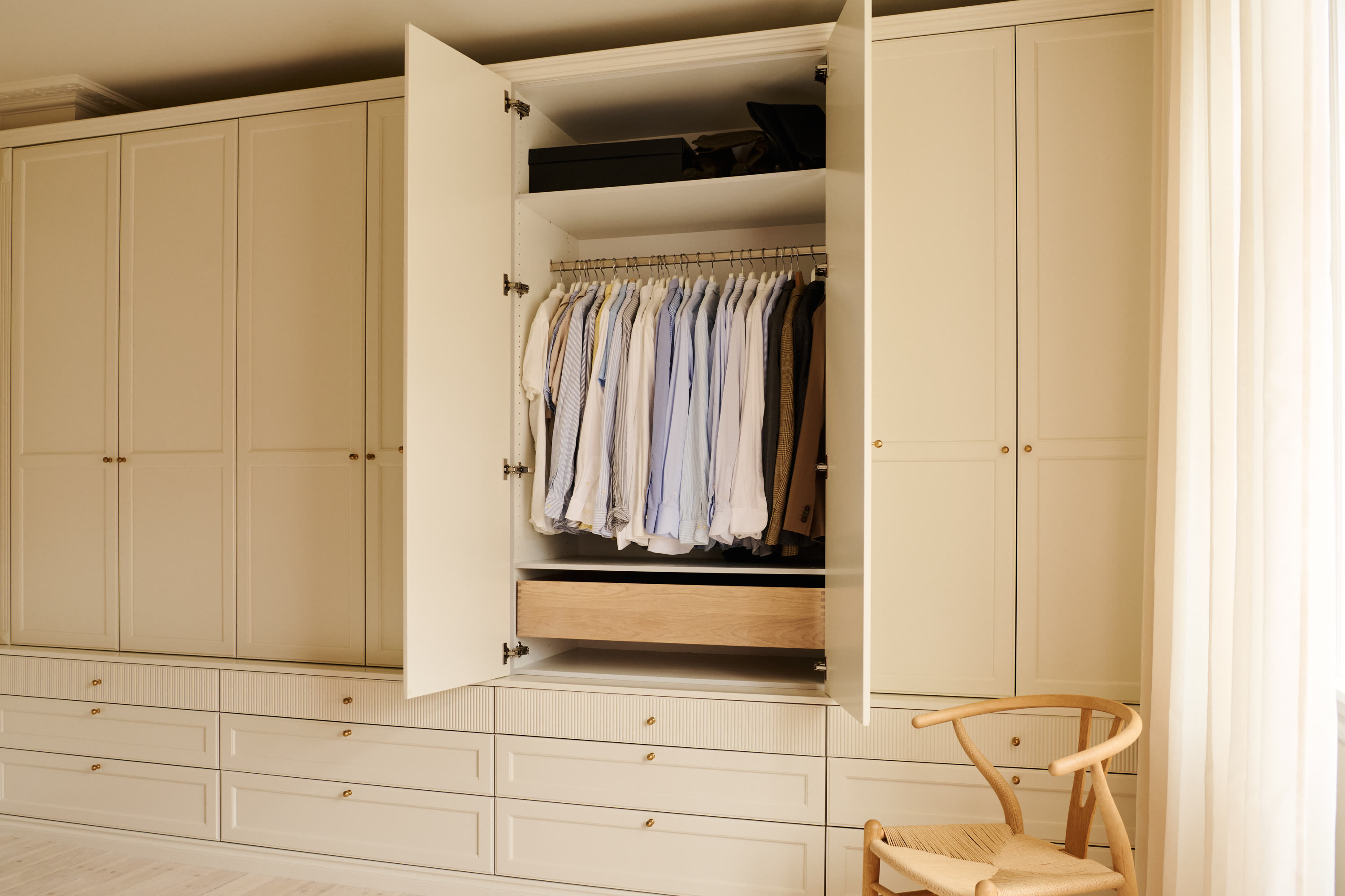 Shirts inside the open wardrobe