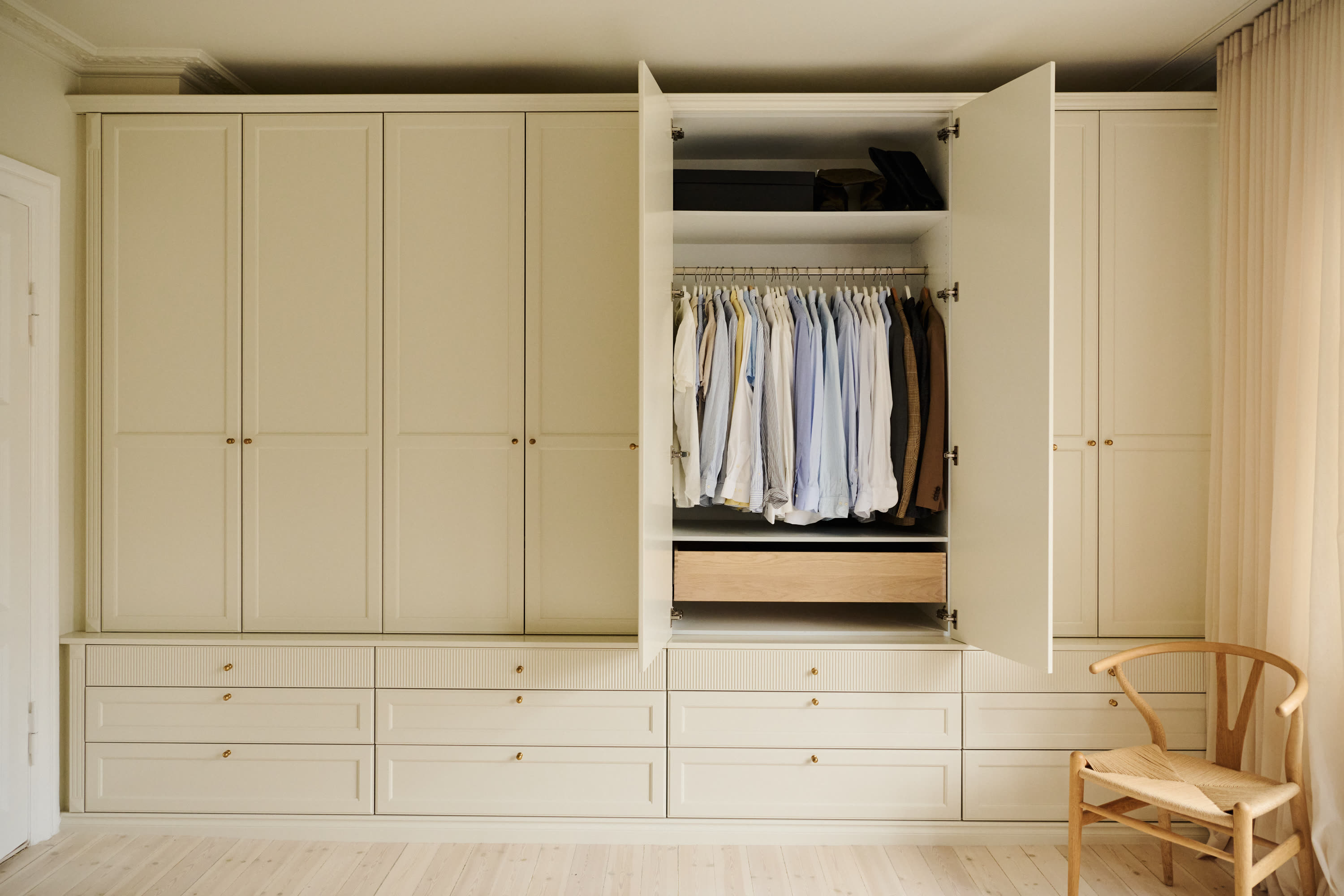 The full wardrobe wall with one door open