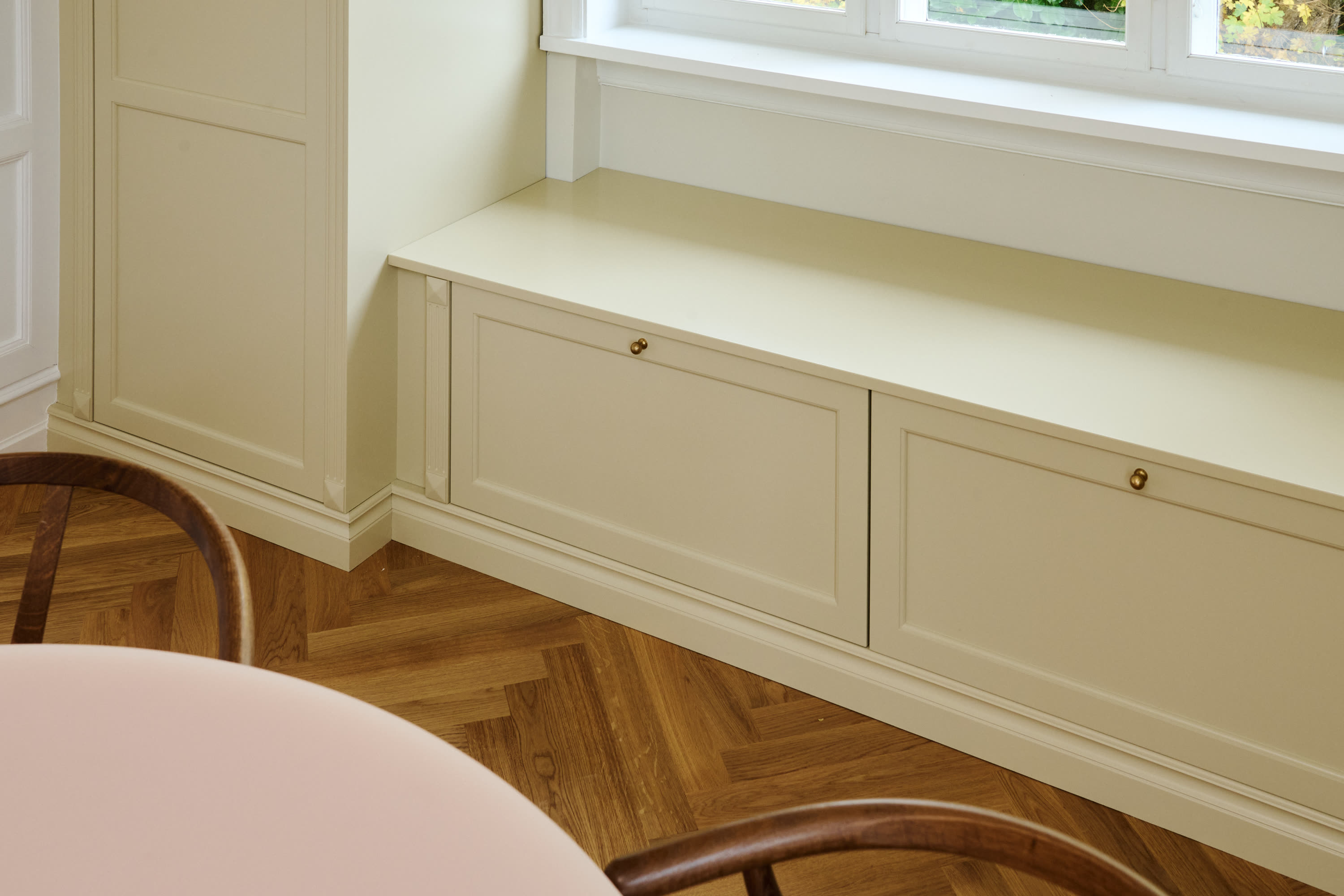 A window seat with built-in drawers