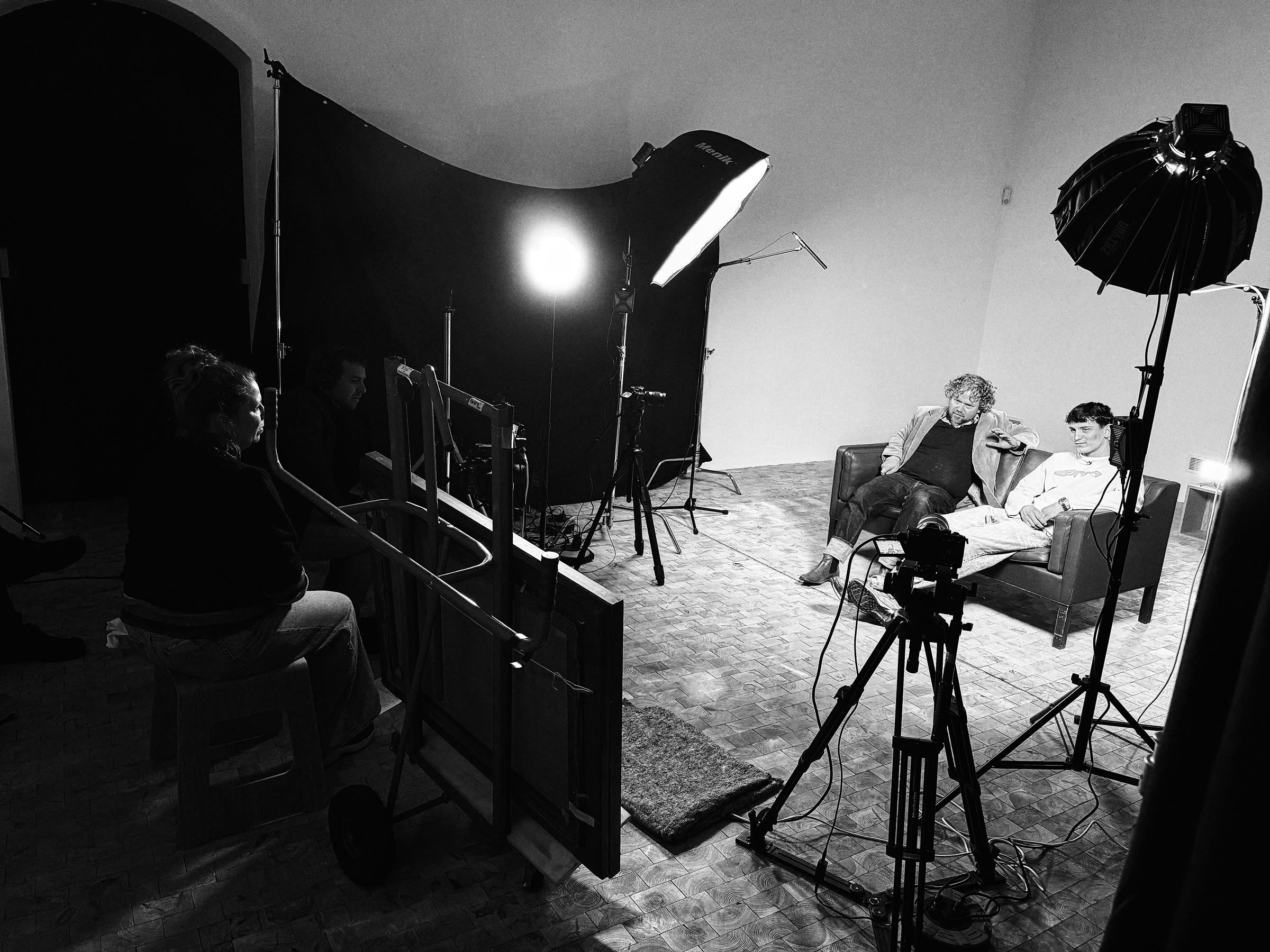 The film set with the red sofa and lights