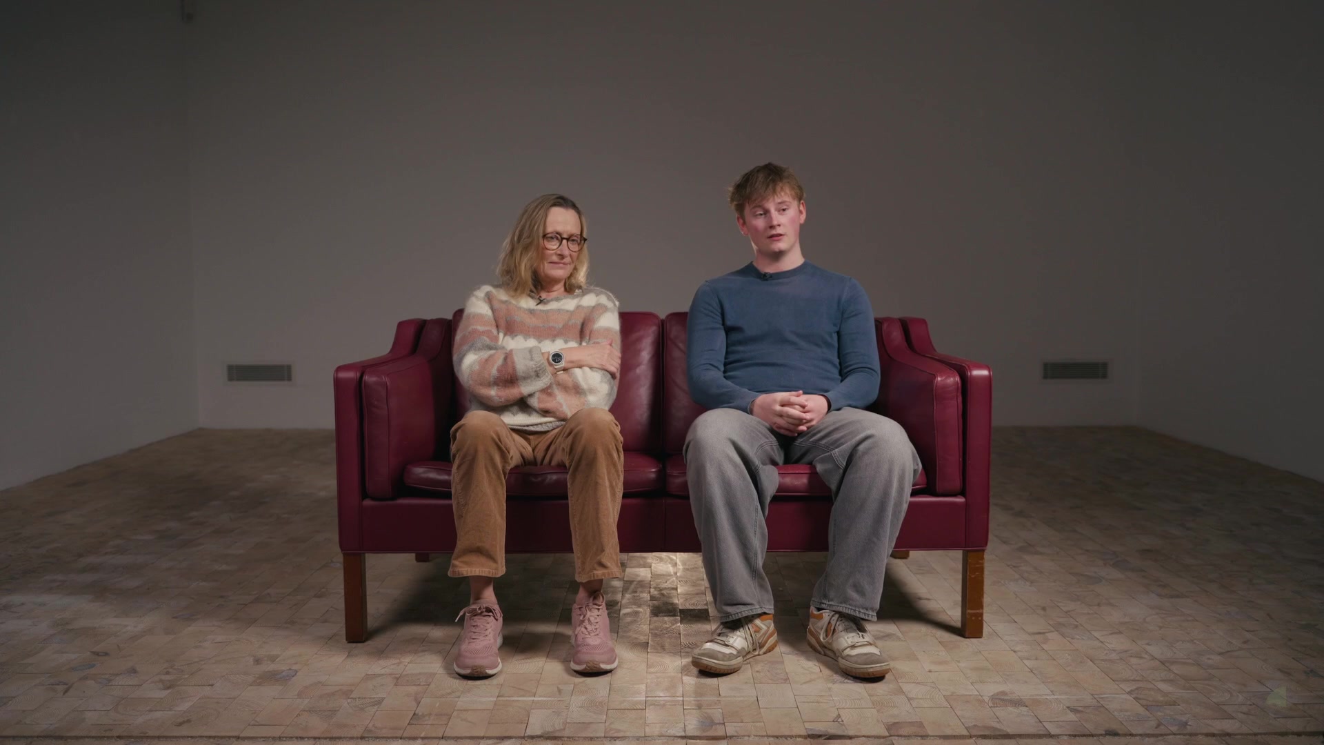 Two participants talking on the sofa