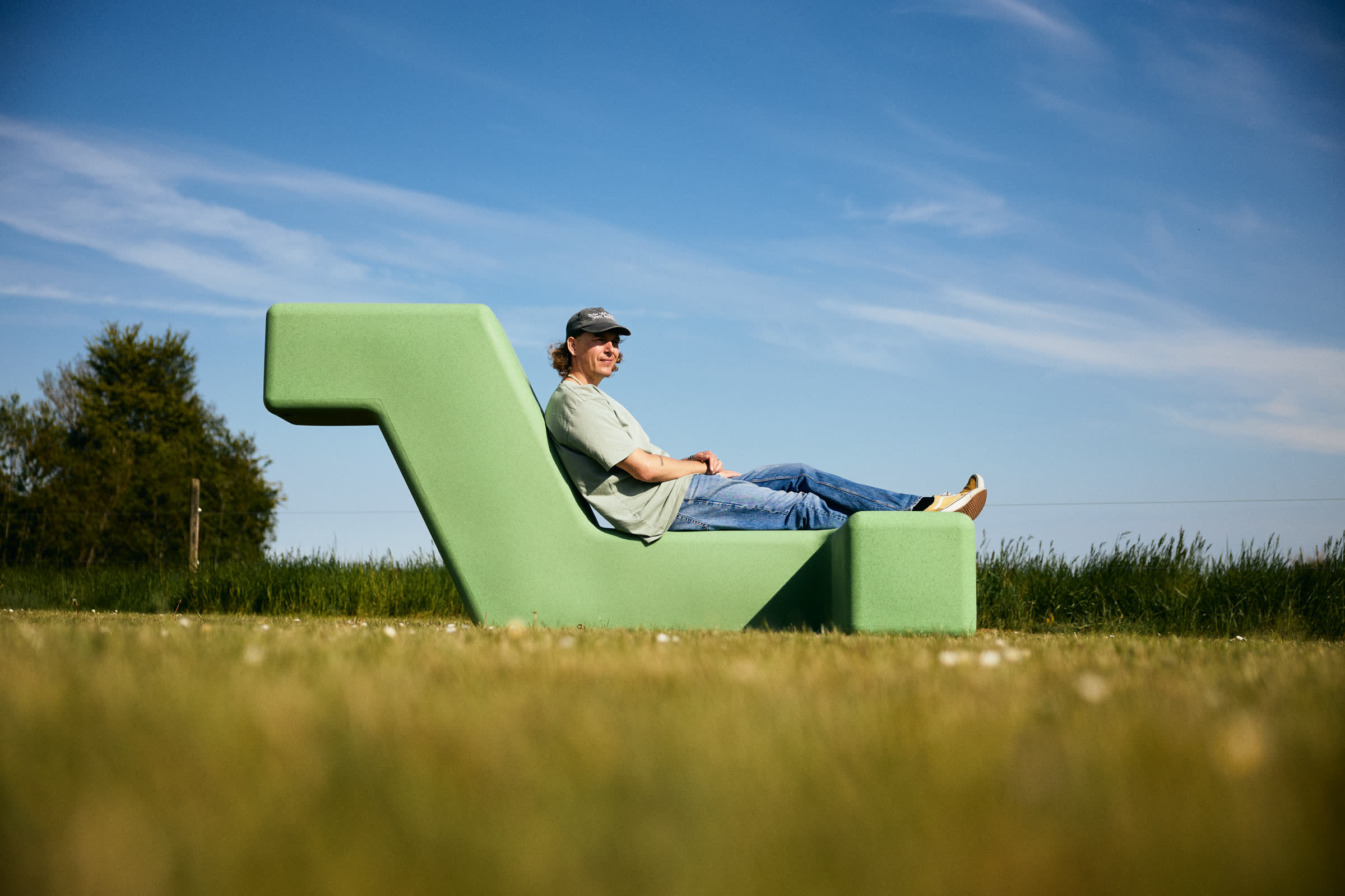 Resting on a green LOOP lounger